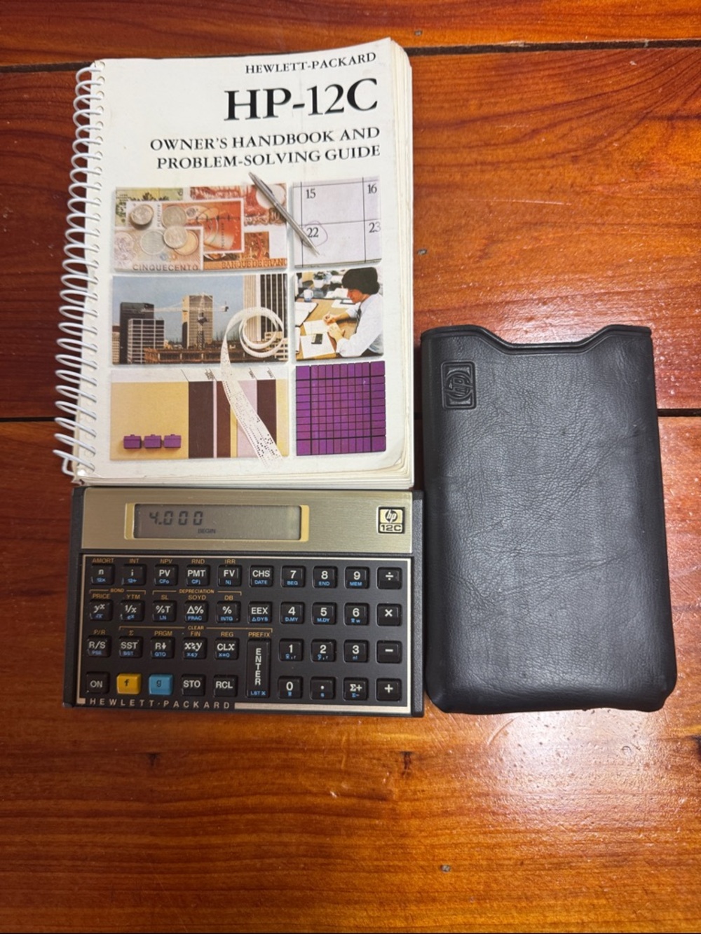 HP-12C Financial Calculator with Black Leather Case and White Manual